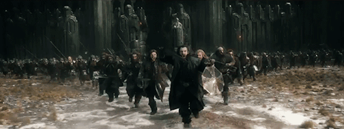Gif of angry army charging with swords drawn